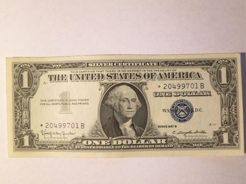 Which year did the USA print its last silver certificate dollar?