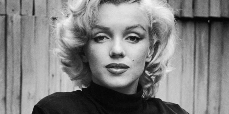 In which film did Marilyn Monroe co-star with Betty Grable and Lauren Bacall