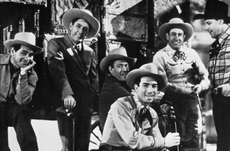Who was the first "singing cowboy" of the movies?