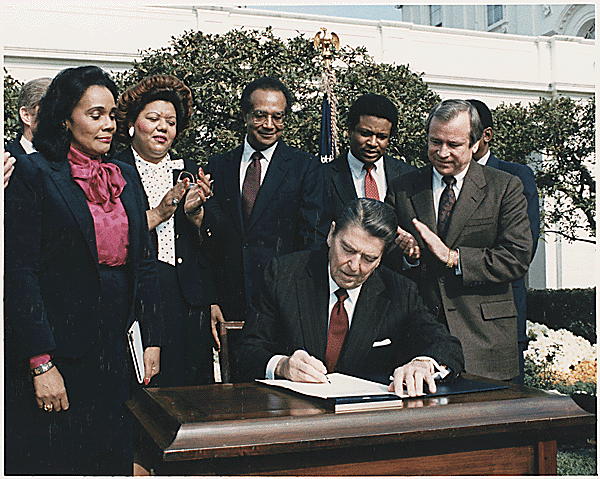 What day was Dr. Martin Luther King, Jr. National Holiday Law signed by President Ronald Reagan? What day was Dr. Martin Luther King, Jr. National Holiday Law signed by President Ronald Reagan?