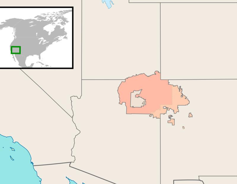 What Native American nation located in parts of Arizona, New Mexico, and Utah occupies the largest designated reservation in area?