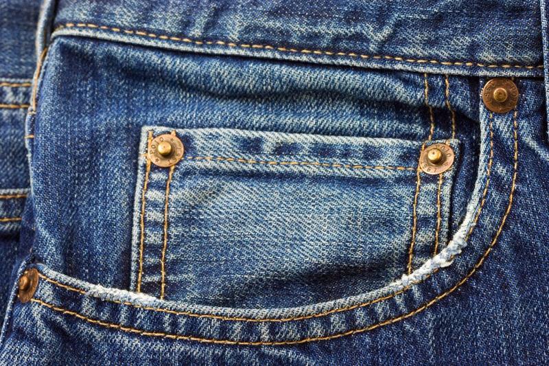 A traditional pair of jeans has a tiny pocket just above the front pocket. What was originally supposed to be kept in the tiny pocket?