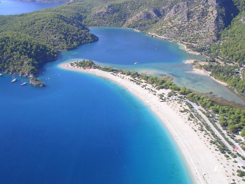 An area of relatively shallow water separated from open marine conditions by a barrier is known as what? An area of relatively shallow water separated from open marine conditions by a barrier is known as what?