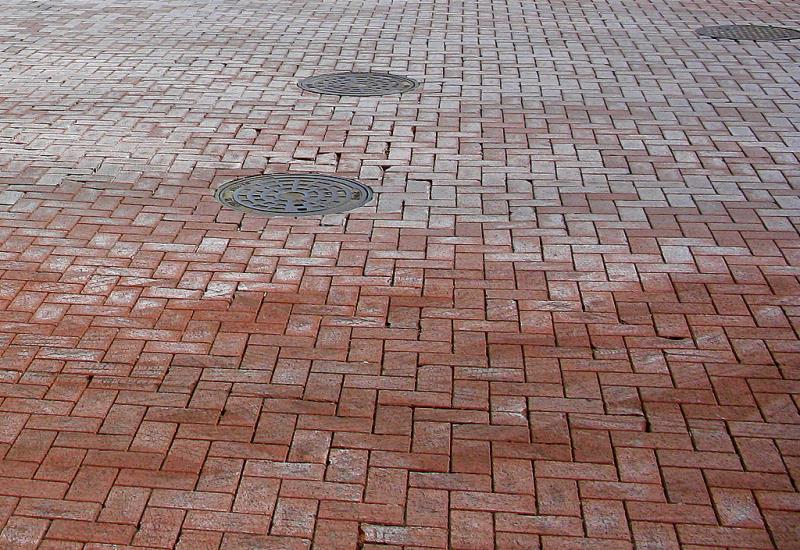 The first brick street in the United States began being built on October 23, 1870 and finished in 1873. What American city holds the distinction of the first brick street?