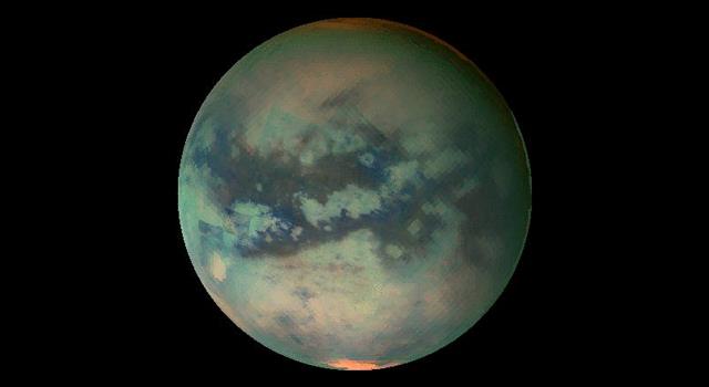 What is the only moon in the solar system known to have a nitrogen atmosphere and liquid seas and lakes?