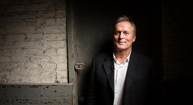 What is the name of the first book published by best-selling novelist John Grisham?