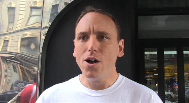 Competitive eater Joey Chestnut is most famous for consuming which food?