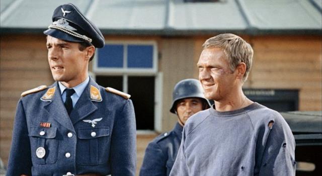 In the film 'The Great Escape', the Cooler King passes time in solitary confinement with the help of what ball? In the film 'The Great Escape', the Cooler King passes time in solitary confinement with the help of what ball?
