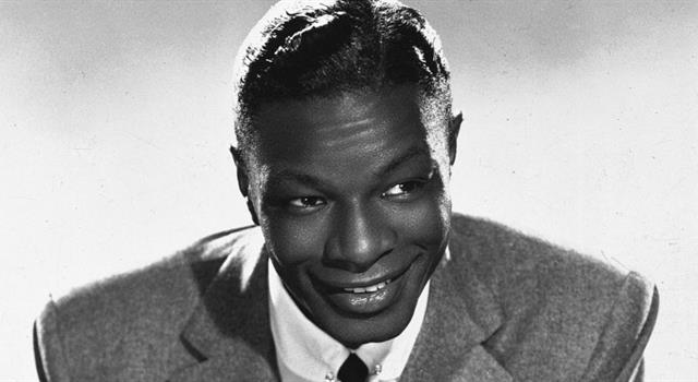 History Trivia Question: Which multi-talented person wrote the music to Nat King Cole's hit song 'Smile'? History Trivia Question: Which multi-talented person wrote the music to Nat King Cole's hit song 'Smile'?