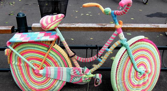 Culture Trivia Question: Which activity involves secretly putting knitted coverings on statues and public objects without official permission? Culture Trivia Question: Which activity involves secretly putting knitted coverings on statues and public objects without official permission?
