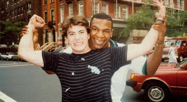 Society Trivia Question: Who is in the picture with Mike Tyson? Society Trivia Question: Who is in the picture with Mike Tyson?